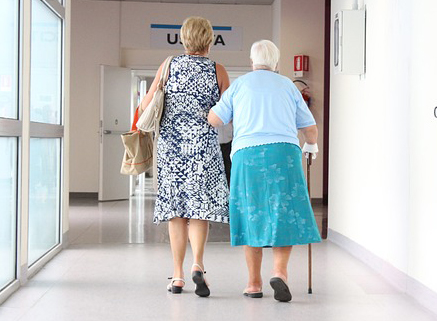 Movers helping a senior customer with a downsizing move